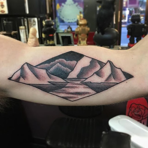 Explore lower back tattoo ideas, creative tattoo ideas in Dekalb, available at Proton Tattoo