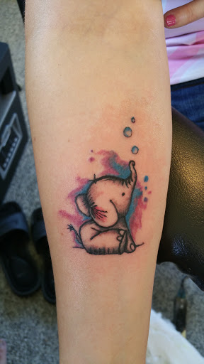 Find tattoo wedding band ideas for your next unique tattoo in Moweaqua at Fleshwound Tattoo