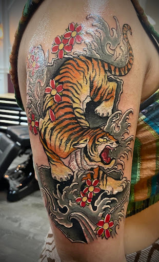 Explore blackout tattoo ideas, creative tattoo ideas in Westland, available at Premier Tattoo Company Westland