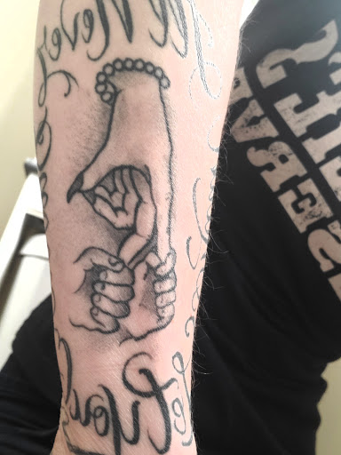 Explore behind the ear tattoo ideas, creative tattoo ideas in Pigeon Forge, available at Black Orchid Tattoo Studio