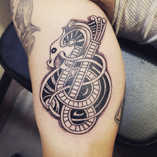 Explore atlas tattoo ideas, creative tattoo ideas in Frisco, available at Frisco Tattoo Company - Steel PaintBrush