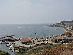 Foto von Porto Palma Beach von Klippen umgeben