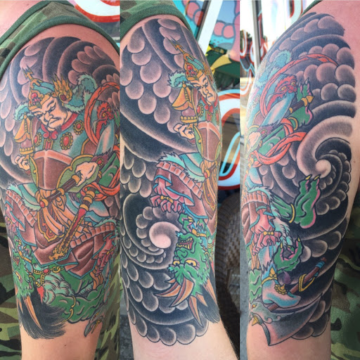 Explore back arm tattoo ideas, creative tattoo ideas in Elyria, available at Chronic Tattoo