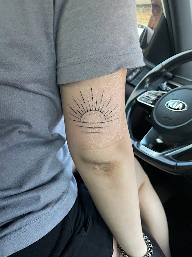 Explore butterfly flower tattoo ideas, creative tattoo ideas in Greenville, available at Bomb Ink