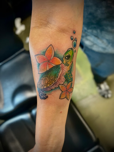 Explore tattoo ideas ear, creative tattoo ideas in Wallace, available at Artistic Abyss Tattoo Collective