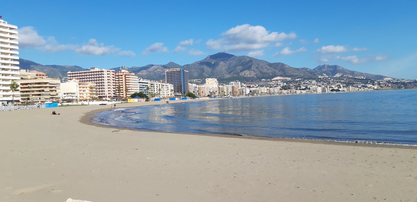 Photo of Fuengirola Beach with gray fine sand surface