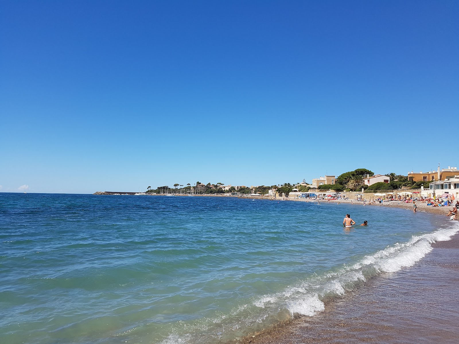 Foto di Spiaggia le Murgidas con una superficie del ciottoli grigi