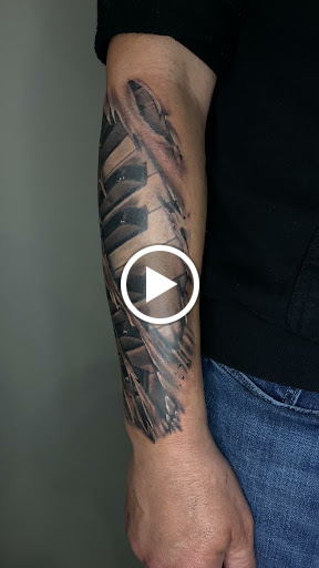 Explore lower back tattoo ideas, creative tattoo ideas in Amherst, available at Wanderlust Tattoo & Piercing