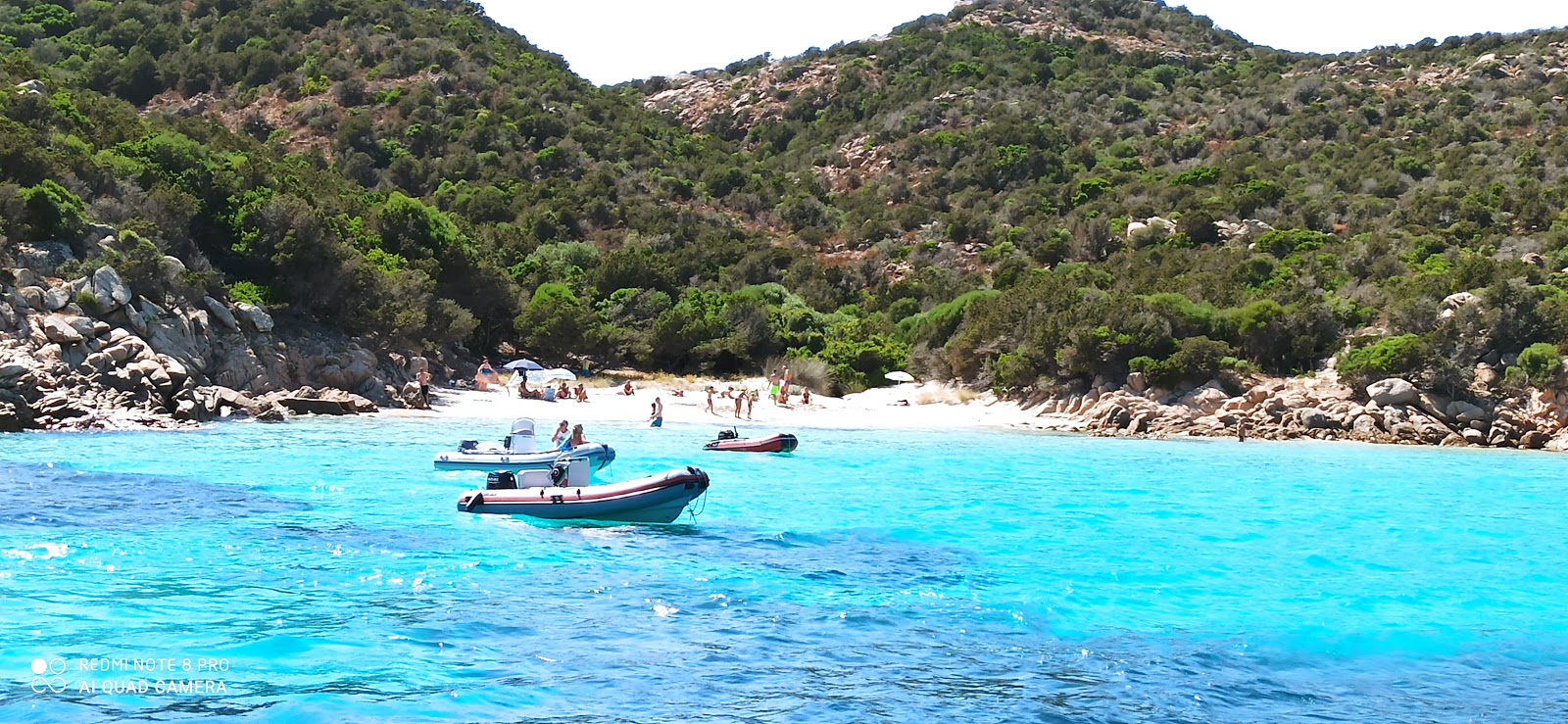 Foto van Cala Dell'amore met turquoise puur water oppervlakte