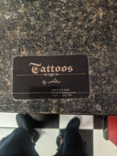 Explore knowledge tattoo ideas, creative tattoo ideas in Columbia, available at Knotty Headz Tattoo Factory & Body Piercings