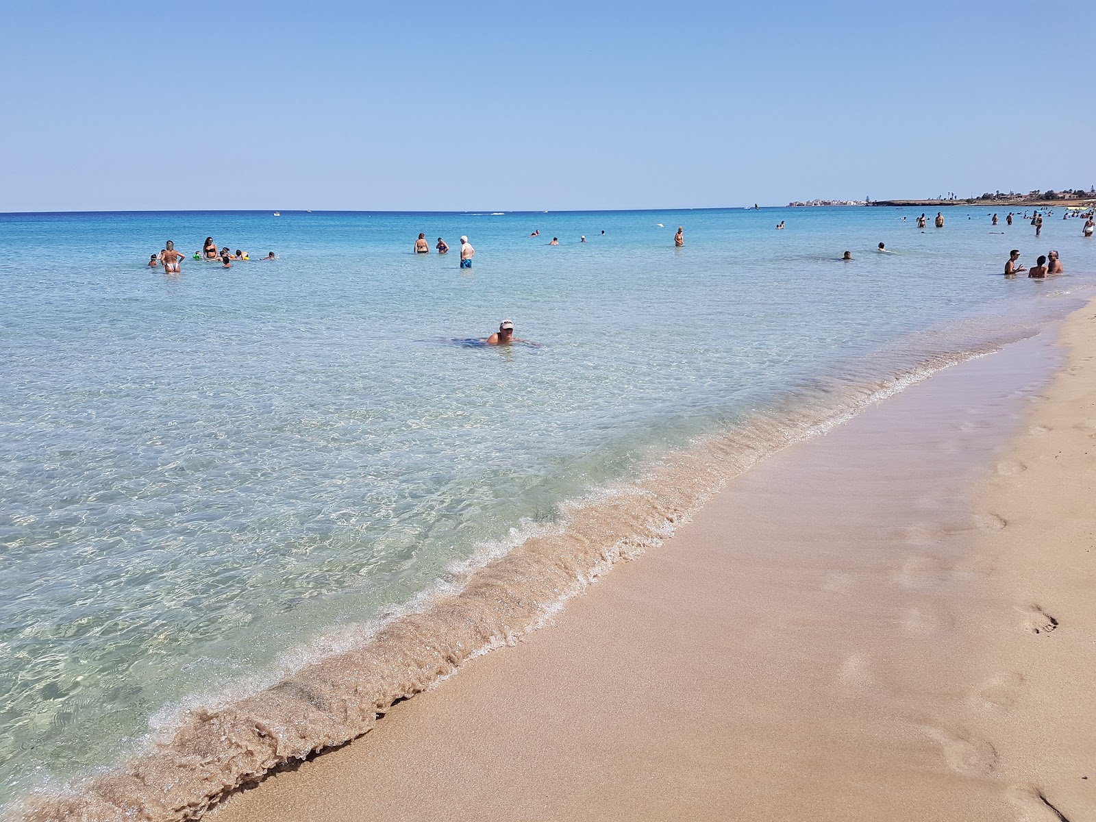 Foto de Praia de San Lorenzo com areia marrom fina superfície