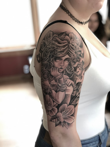 Explore tattoo ideas on calf, creative tattoo ideas in Orange, available at North Quabbin Tattoo