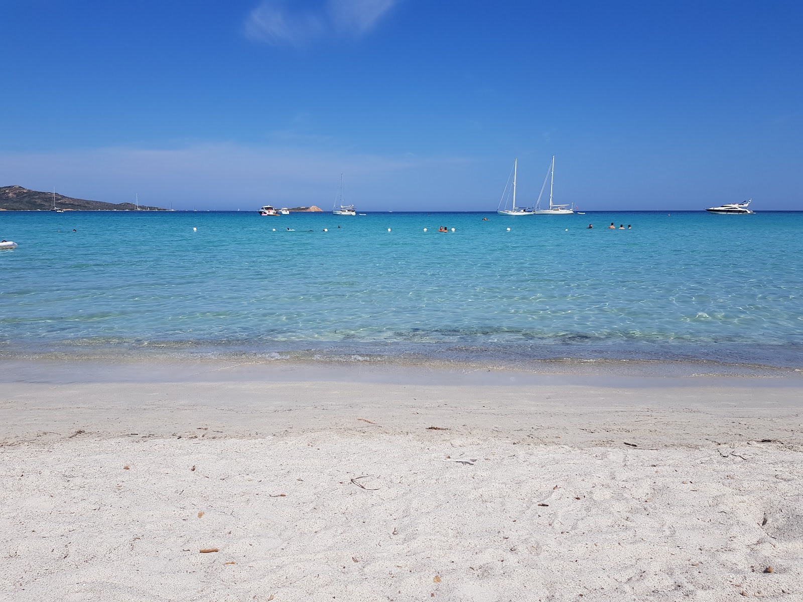 Foto von Lu Impostu Strand mit geräumige bucht