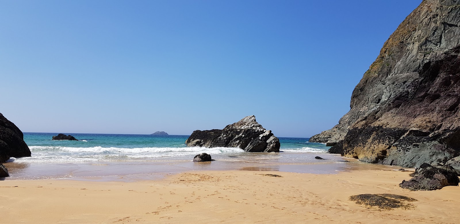 Photo of Butterhole beach with turquoise pure water surface