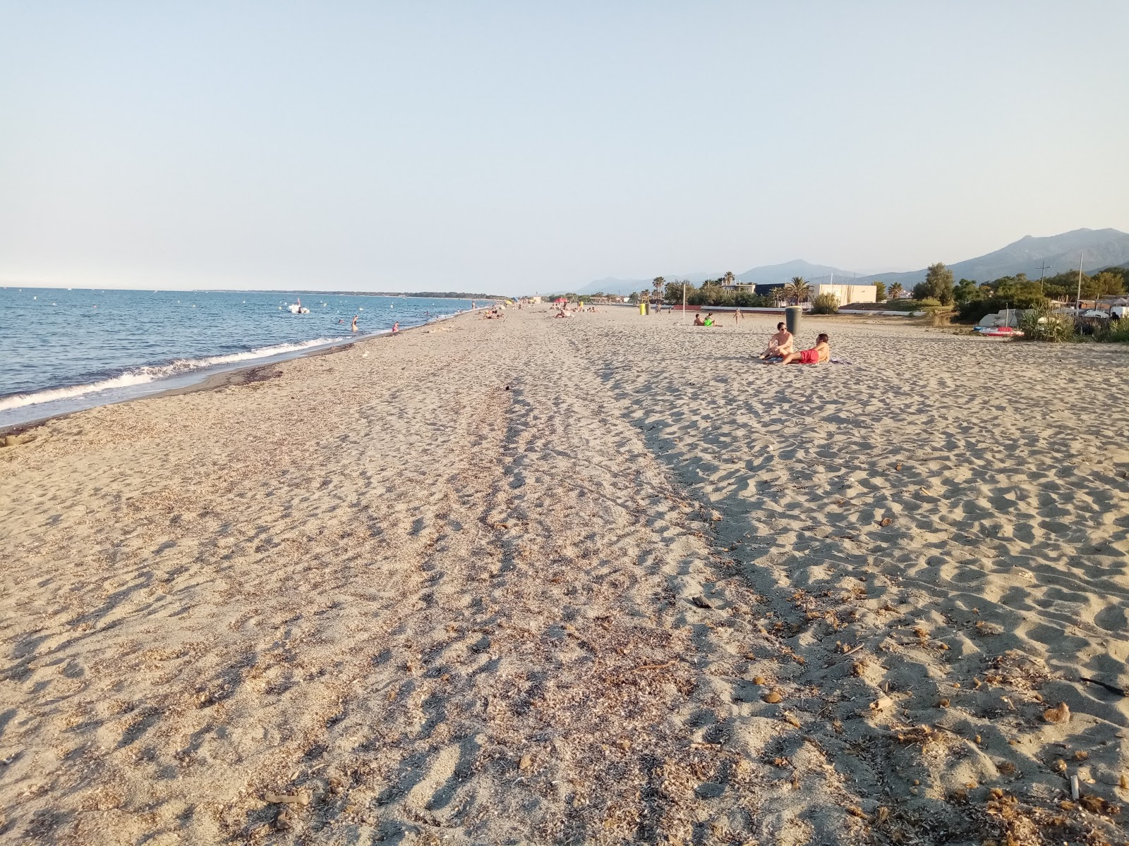 Foto av Plage de l'Arinella med lång rak strand