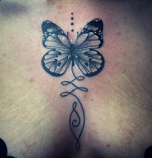 Explore elegant spine tattoo ideas, creative tattoo ideas in Madera, available at Sea Wolf Tattoo
