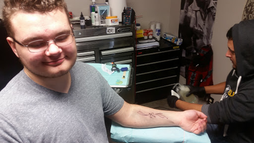 Explore godson tattoo ideas, creative tattoo ideas in Idaho Falls, available at Spiders Web