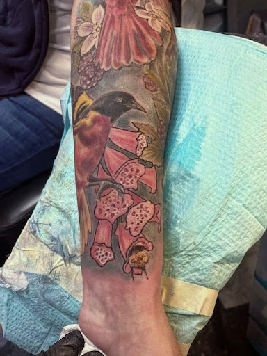 Explore iris flower tattoo ideas, creative tattoo ideas in Belle Vernon, available at Black Star Tattoo