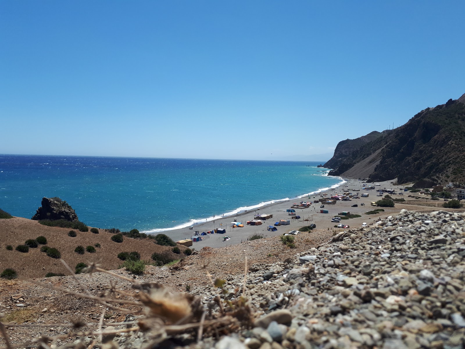 Photo de Plage Beni Baroun avec caillou fin gris de surface