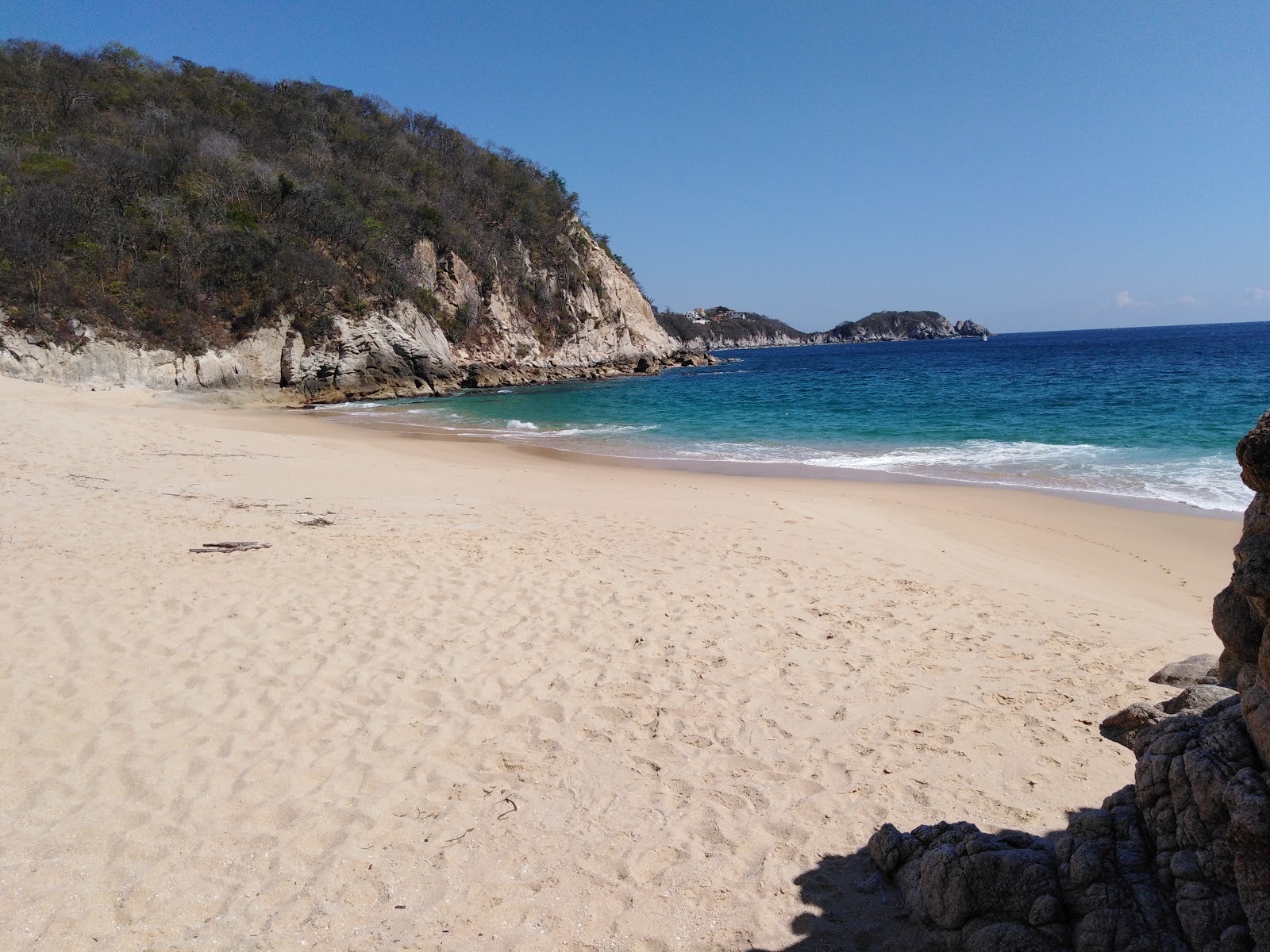 Photo of Esperanza beach with bright fine sand surface