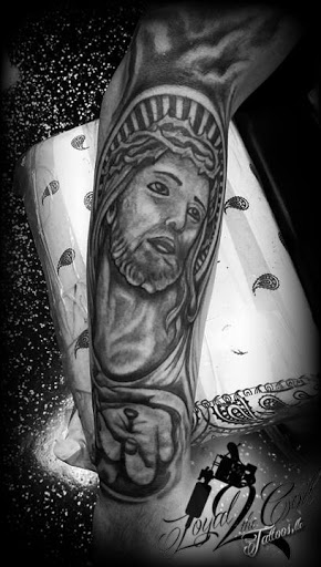 Explore cross tattoo sleeve ideas, creative tattoo ideas in North Fort Myers, available at Loyal 2 The Coil Tattoos & Body Piercings