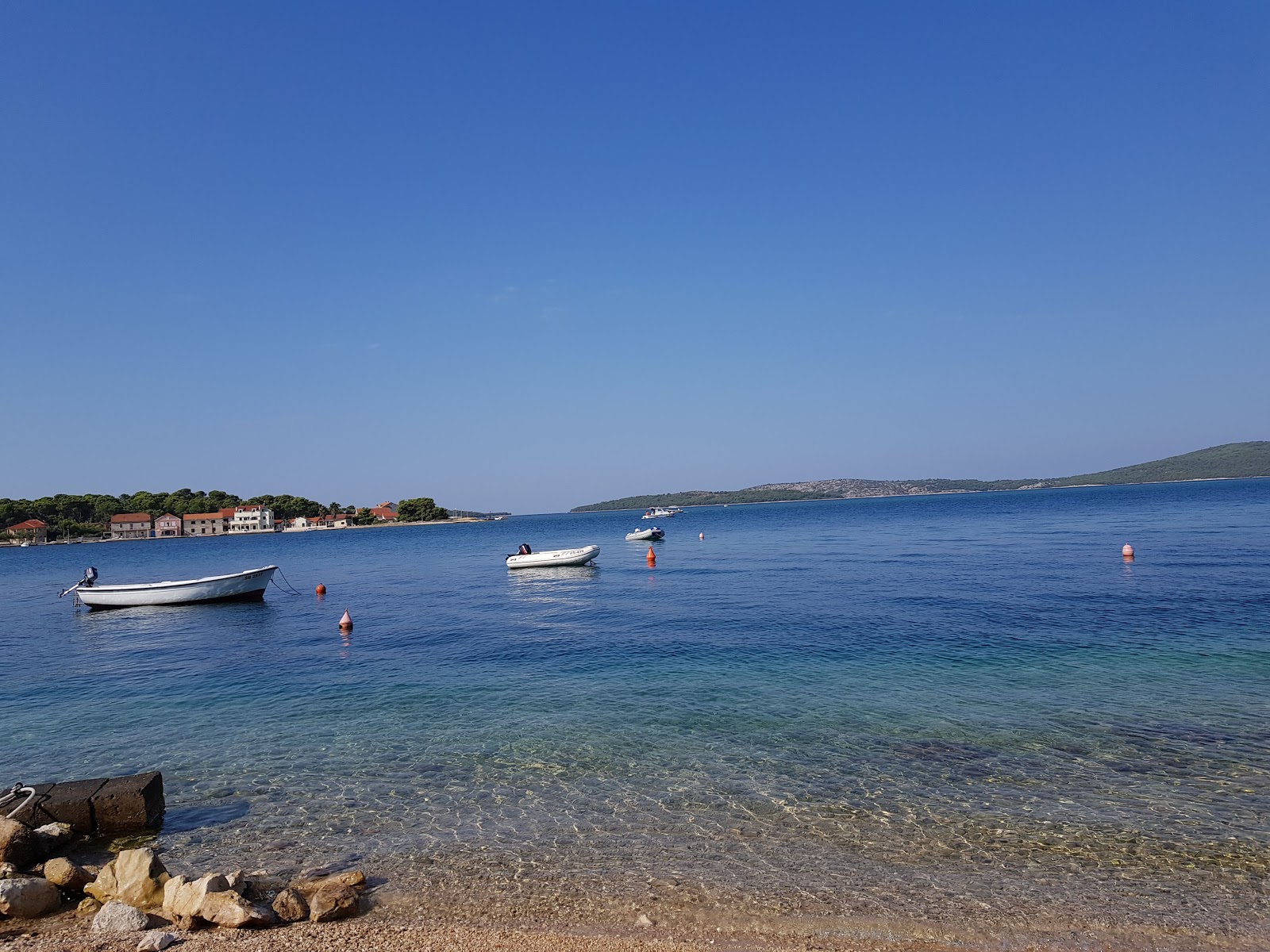 Photo of Brodarica beach with turquoise pure water surface