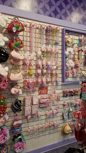 Explore lower back tattoo ideas for females, creative tattoo ideas in Carson, available at Claires