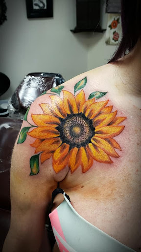 Explore banner tattoo ideas, creative tattoo ideas in Flint, available at Black Eye Social Club Tattoo