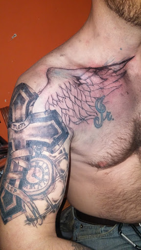 Explore lily flower tattoo ideas, creative tattoo ideas in Paris, available at Twizted Dezignz