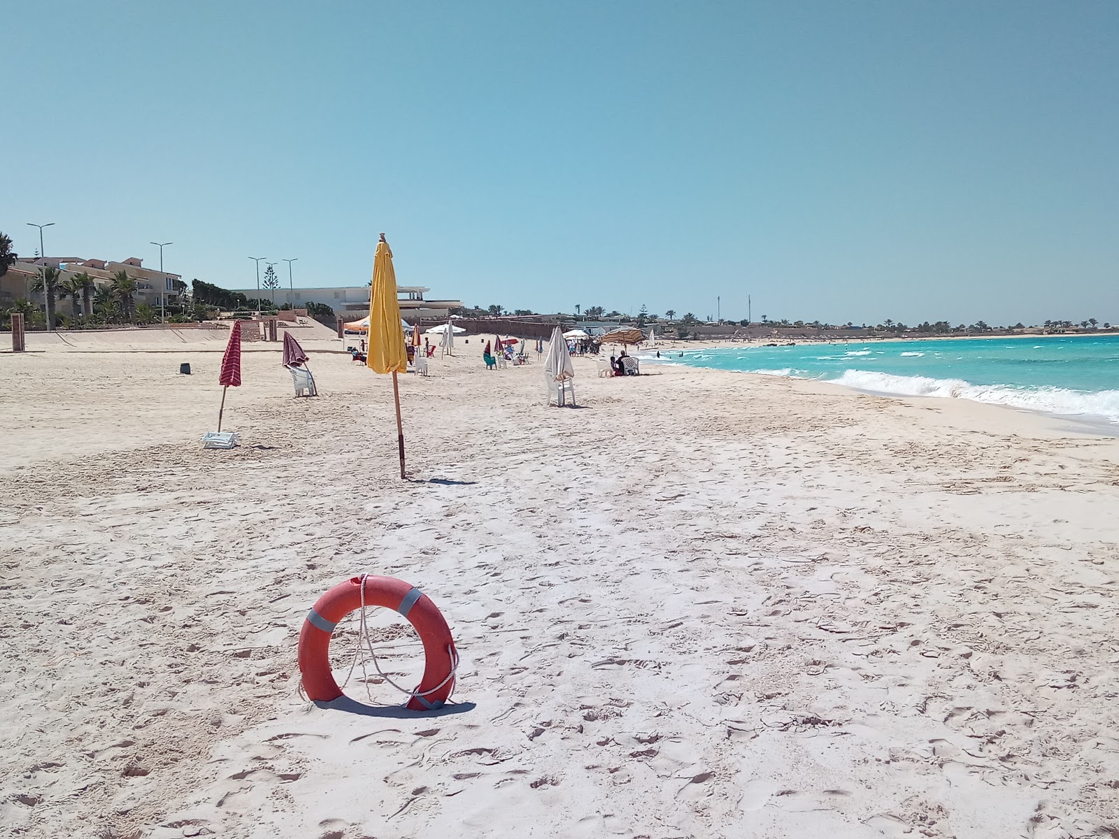 Foto de Baghoosh Beach con arena fina beige superficie
