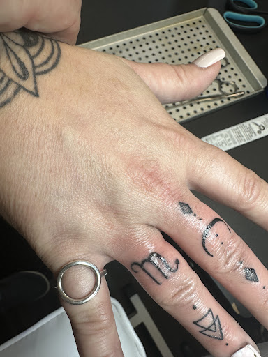 Explore floral hand tattoo ideas, creative tattoo ideas in Williamsburg, available at 315 underground INK LLC
