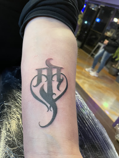 Explore daughter name tattoo ideas for dad, creative tattoo ideas in Oak Grove, available at NeverMore Galleries Tattoo Studio