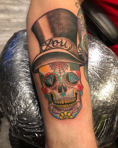 Explore tattoo ideas on back of neck, creative tattoo ideas in Albany, available at The Curly Wolf Tattoo Club