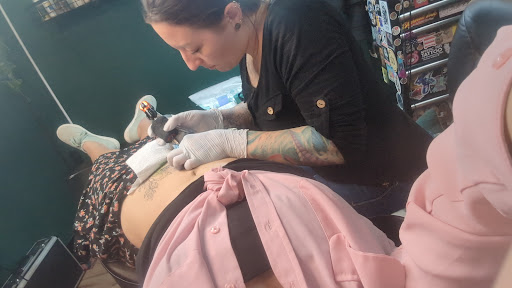 Explore upper thigh tattoo ideas, creative tattoo ideas in Summerville, available at Mystic Tiki Tattoo Studio & Gallery
