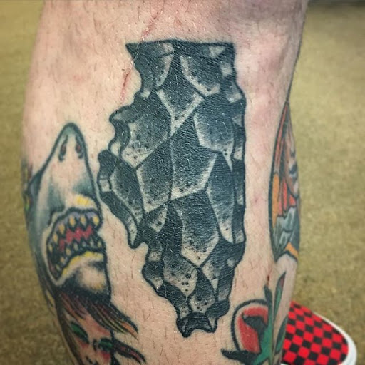 Explore barber pole tattoo ideas, creative tattoo ideas in Dekalb, available at Proton Tattoo