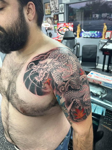 Explore heavy equipment tattoo ideas, creative tattoo ideas in Fort Myers, available at Loyal 2 The Coil Tattoos & Piercings (Edison Mall Location Entrance F)