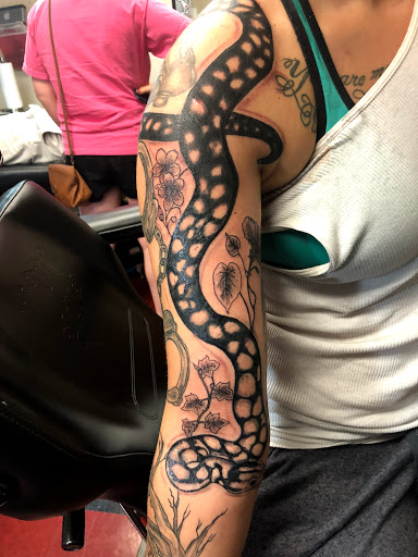 Explore small country tattoo ideas, creative tattoo ideas in Charlottesville, available at Mystic Tattoo and Body Piercing