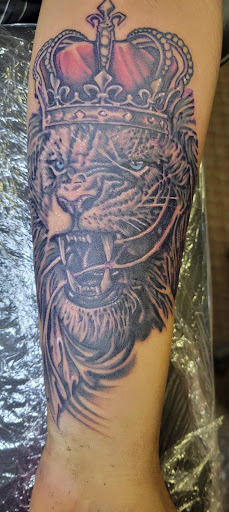 Explore guy leg tattoo ideas, creative tattoo ideas in Angola, available at Hoodlum Ink