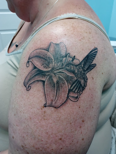 Explore large cover up tattoo ideas female, creative tattoo ideas in Calhoun, available at Velvet Panther Tattoo and Piercing