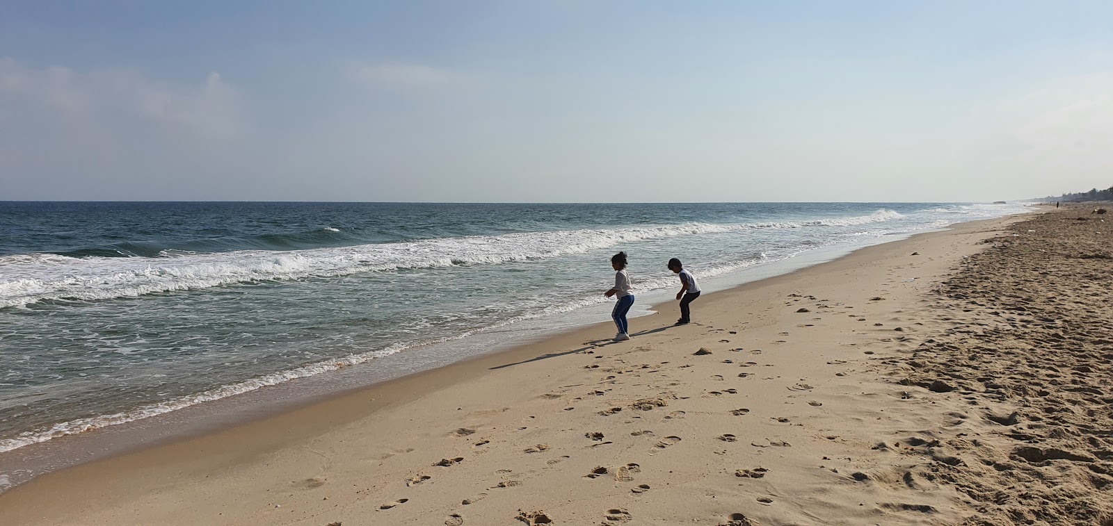 Foto van Basata Beach met helder zand oppervlakte