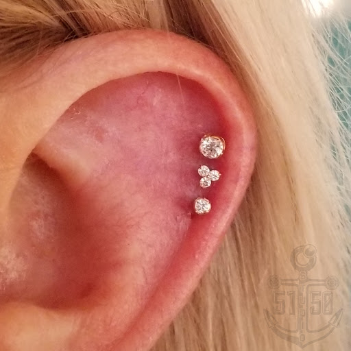 Explore small dinosaur tattoo ideas, creative tattoo ideas in Kearney, available at Studio 5150 Piercing & Fine Jewelry