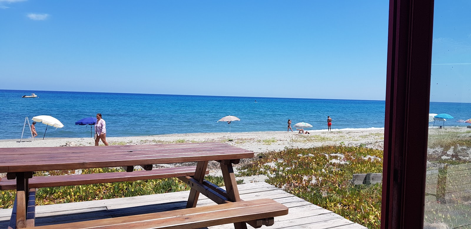 Foto di Baghera beach con una superficie del acqua cristallina