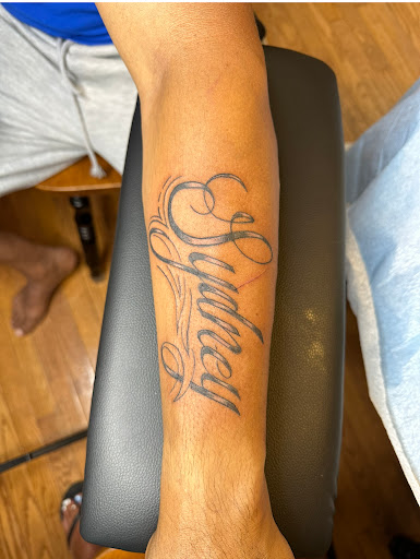 Explore upper arm tattoo ideas for females, creative tattoo ideas in Blackwood, available at Candi Girl Ink