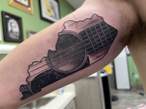 Explore cheshire cat tattoo ideas, creative tattoo ideas in Campbellsville, available at Green River Tattoo Company