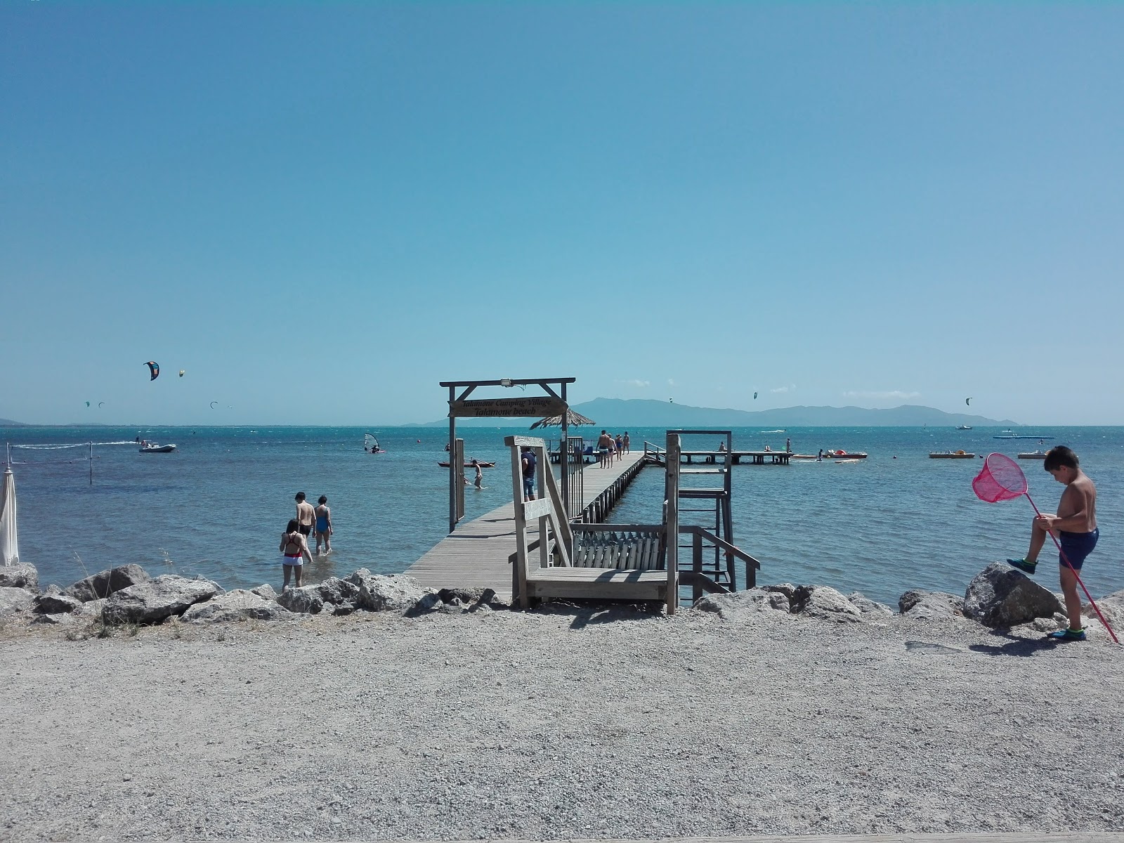 Spiaggia Molo di Talamone'in fotoğrafı - rahatlamayı sevenler arasında popüler bir yer