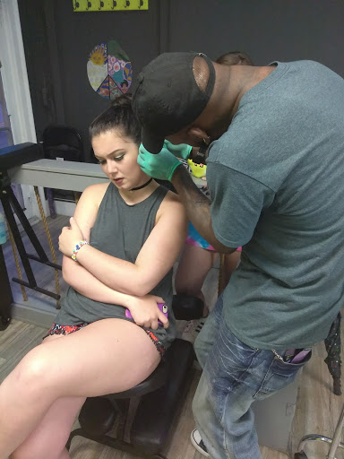 Explore dark cover up tattoo ideas, creative tattoo ideas in Atlanta, available at Iron Palm Tattoos & Body Piercing Atlanta