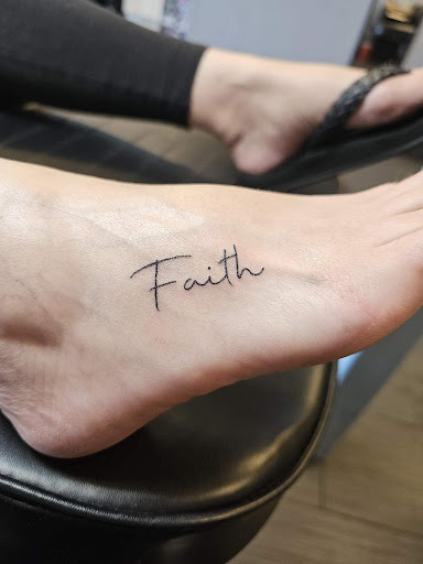 Explore roman numerals tattoo ideas, creative tattoo ideas in Palm Harbor, available at Angry Owl Tattoo and Piercing