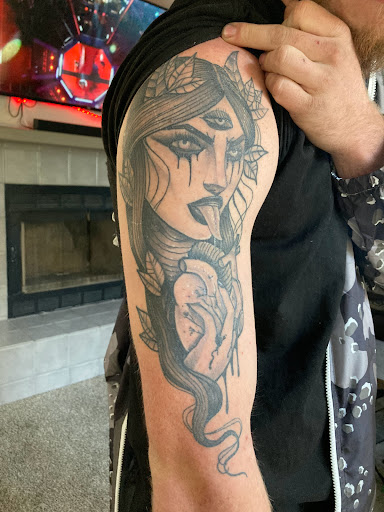 Explore tattoo ideas for losing a brother, creative tattoo ideas in Bullhead City, available at Smoke and Dagger Tattoo