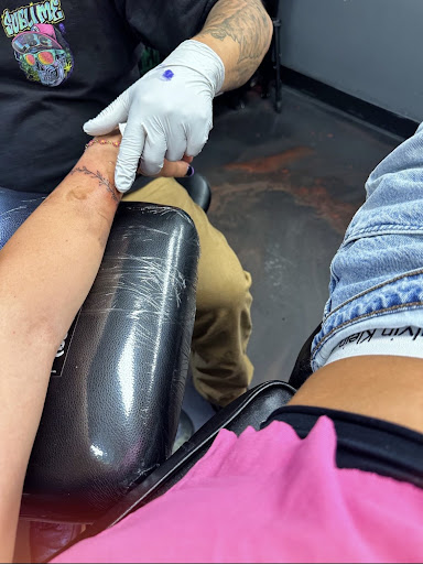 Explore hook tattoo ideas, creative tattoo ideas in Orem, available at Painted Temple Tattoo