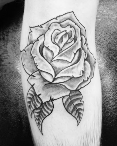Explore men's back shoulder tattoo ideas, creative tattoo ideas in Bowling Green, available at The Mad Tatter, L.L.C.